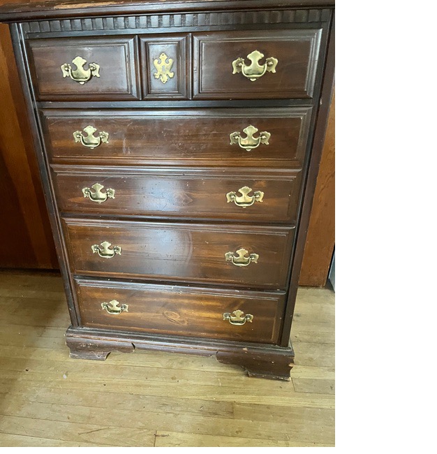 A wooden dresser with gold handles
AI-generated content may be incorrect.